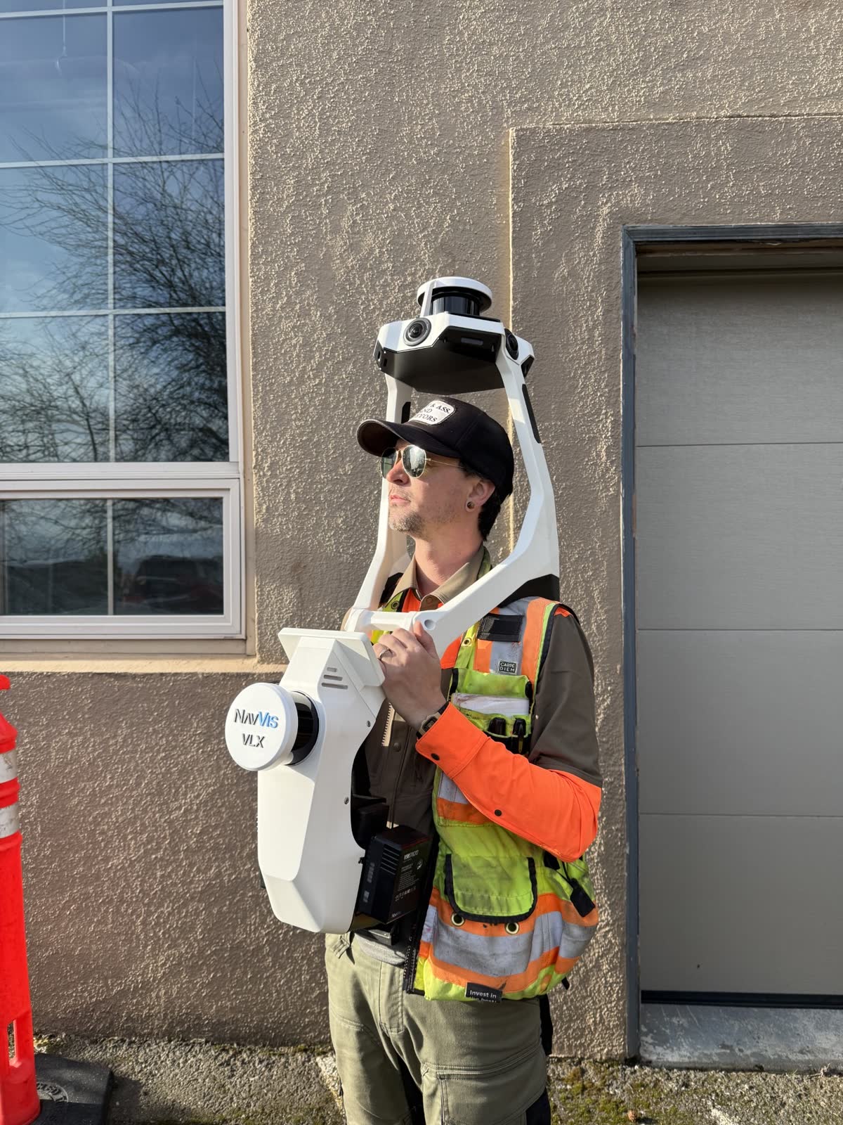 Surveyor carrying the NavVis MLX handheld scanner