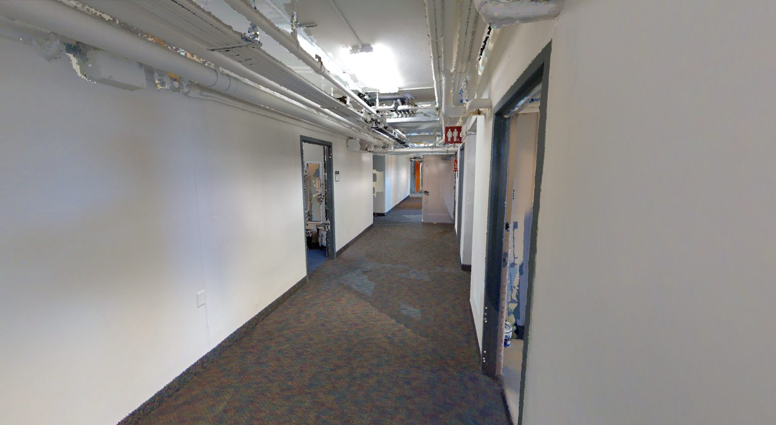 Point cloud of a building corridor showing the pipe and conduit runs overhead