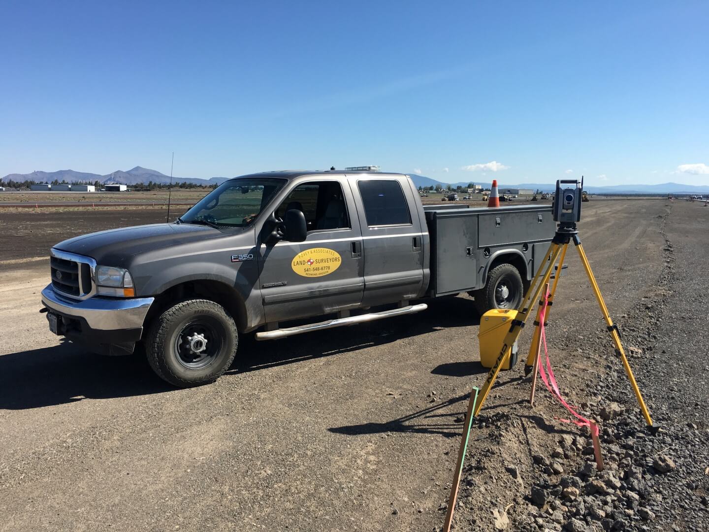 Povey Surveying Redmond Airport with truck oregon mountain image